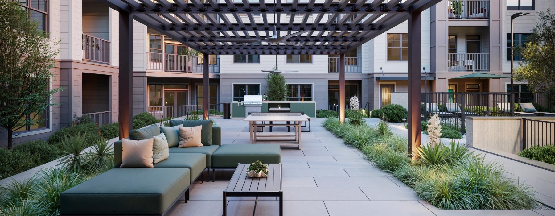 a courtyard with a table and chairs